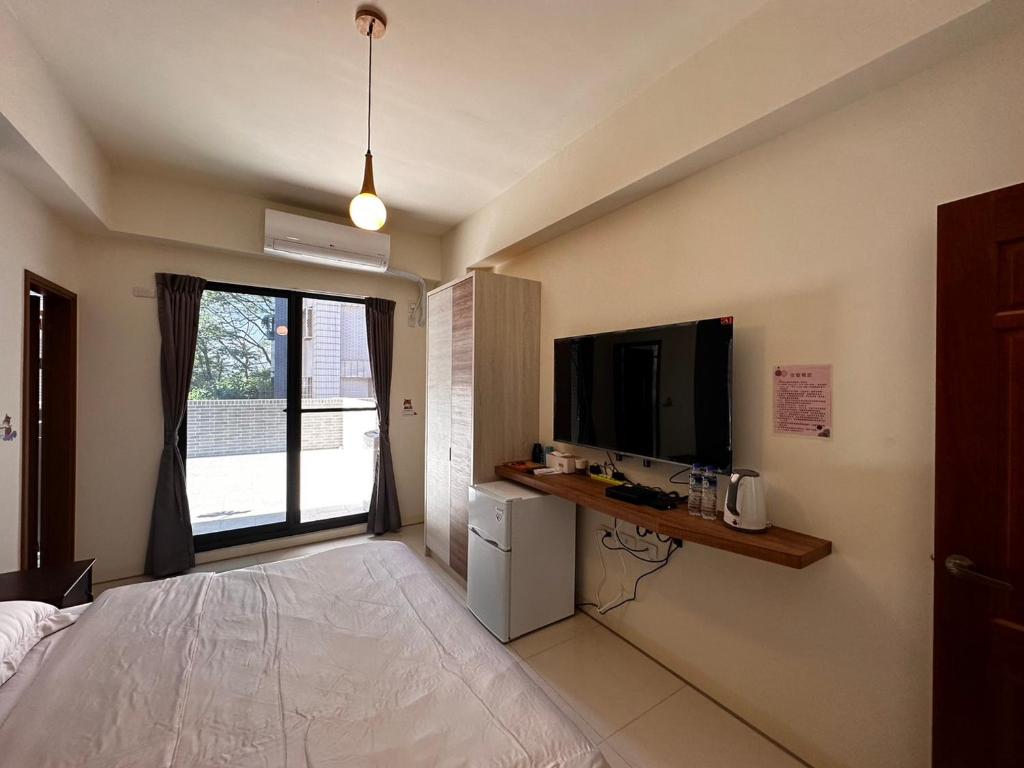TV a/nebo společenská místnost v ubytování Hermes B&B