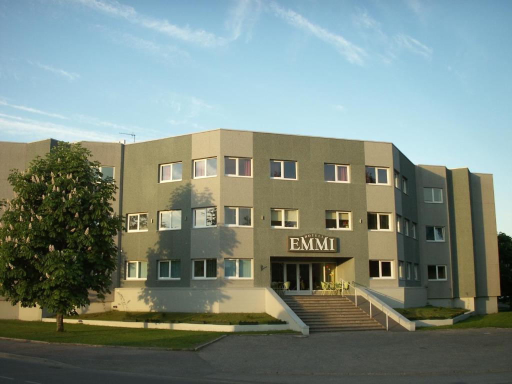 a large building with stairs in front of it at Hotel Emmi in Pärnu