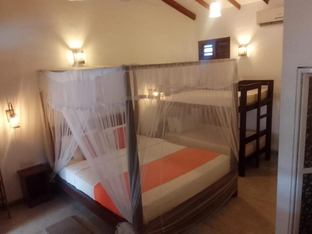 Postel nebo postele na pokoji v ubytování Weligama Ocean Breeze
