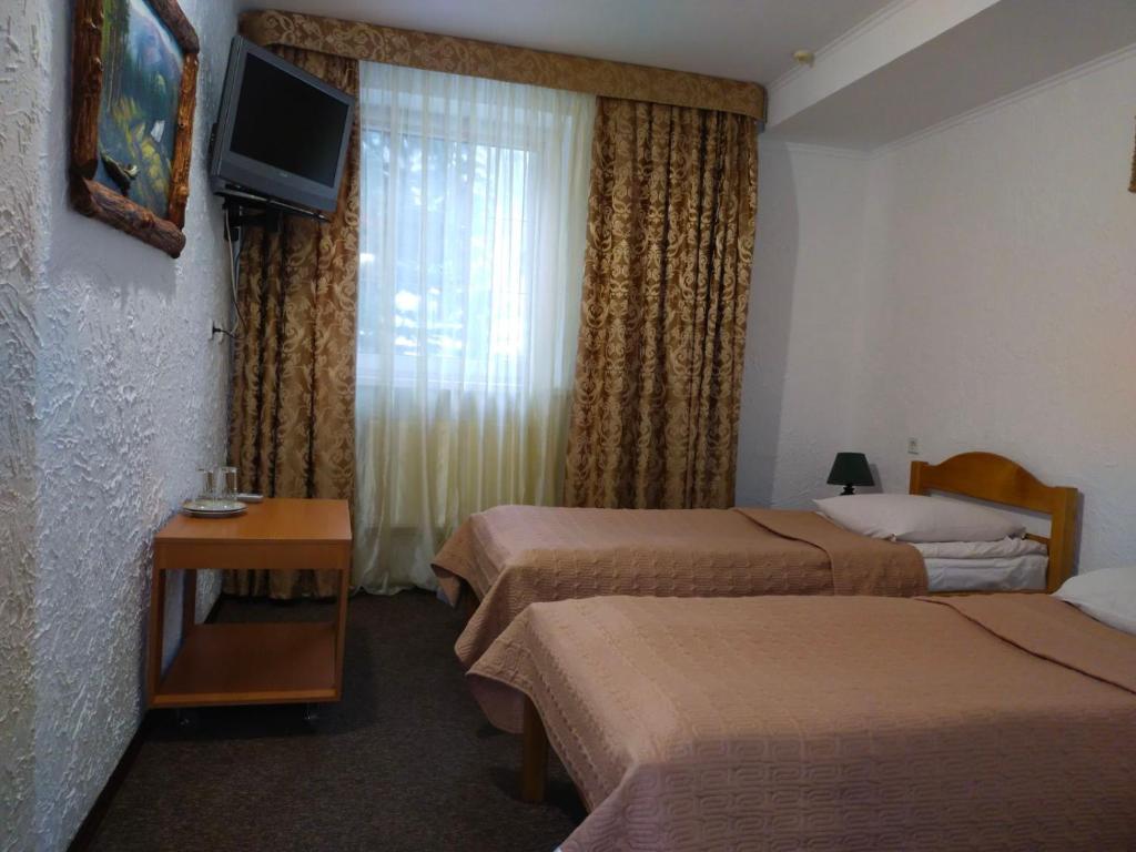 Postel nebo postele na pokoji v ubytování Ra