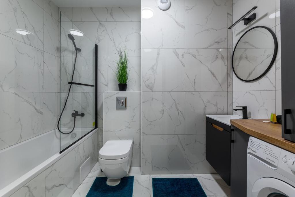 Kúpeľňa v ubytovaní Apartament Rodzinny - Lamelowy Domek