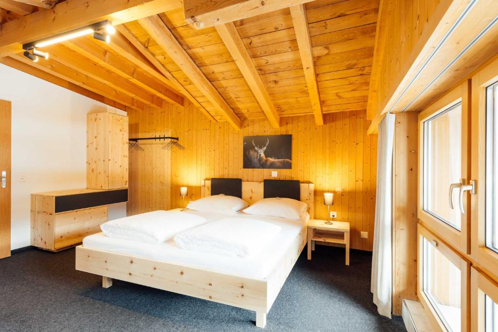 Postel nebo postele na pokoji v ubytování Hotel Krüzli - dapi 1914