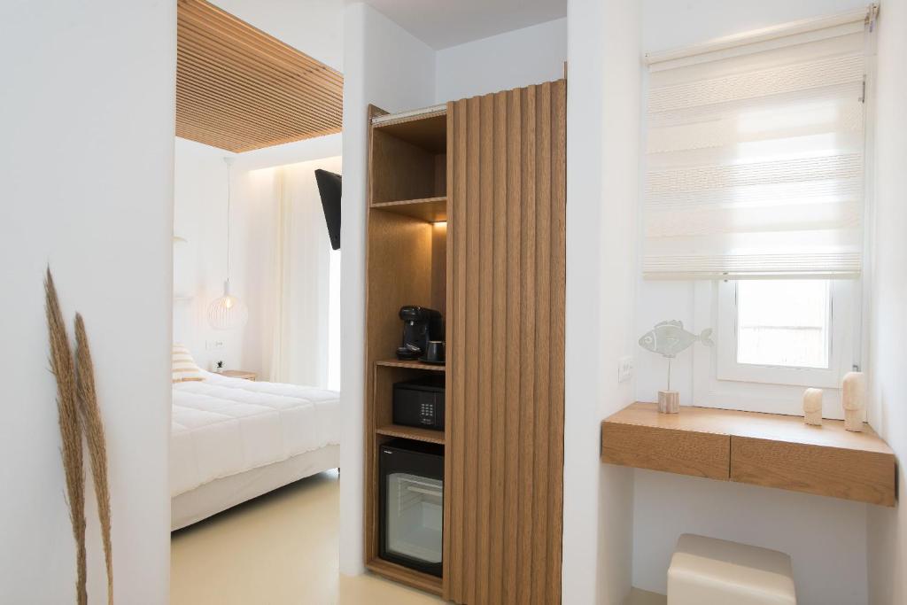 Postel nebo postele na pokoji v ubytování Elit Suites Mykonos