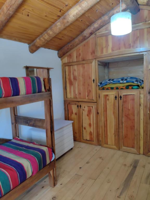 Postel nebo postele na pokoji v ubytování Cabaña Los Abedules