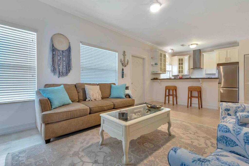a living room with a couch and a table at Spacious 1BR APT Half Mile to Beach Pets Welcome in Lake Worth