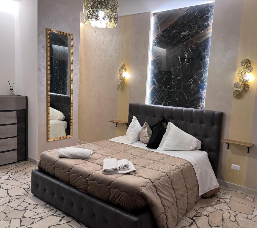 A bed or beds in a room at Residenza N&D Luxury
