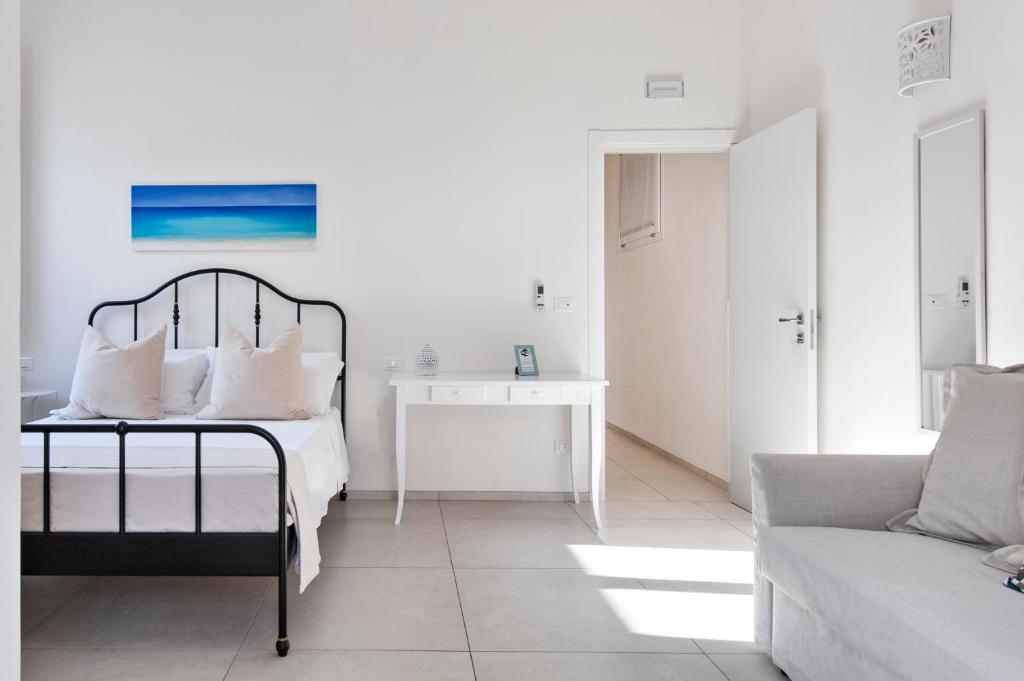 A bed or beds in a room at Merabulò