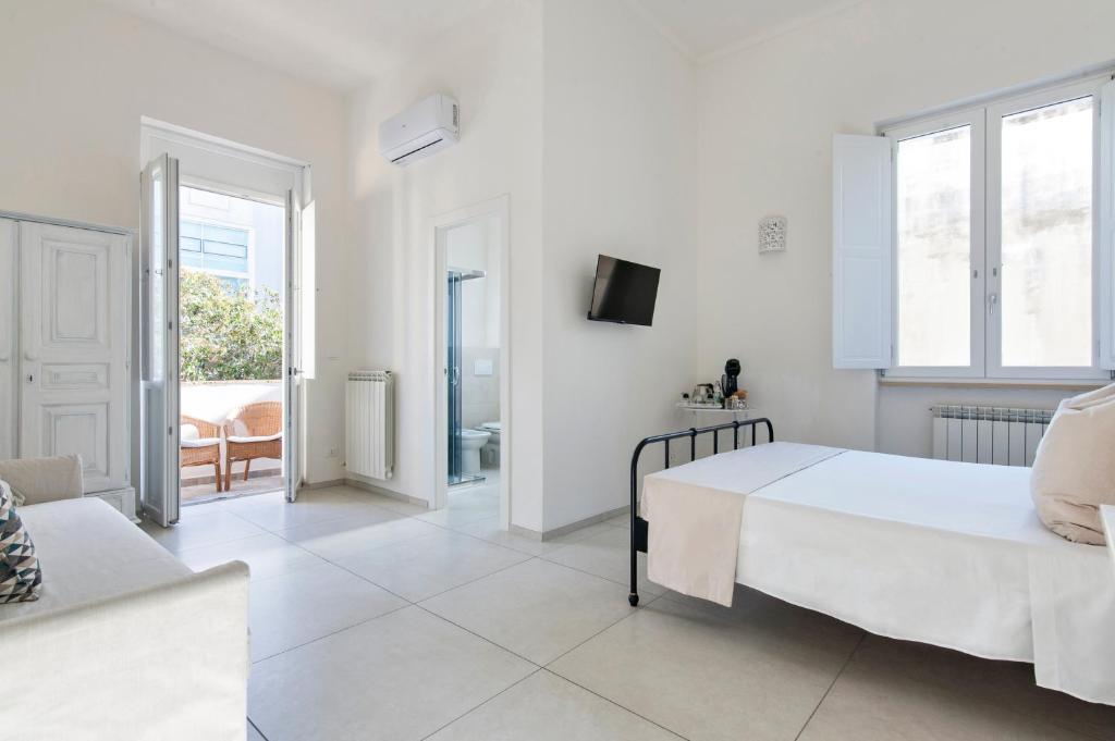 A bed or beds in a room at Merabulò