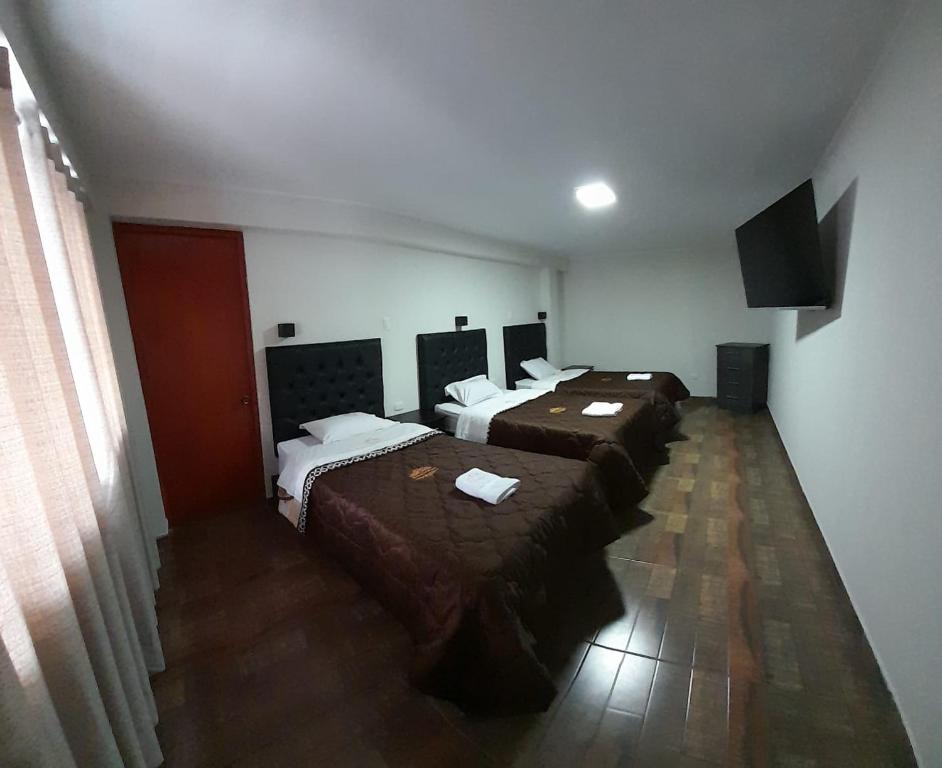 Postel nebo postele na pokoji v ubytování RONALD HOTEL