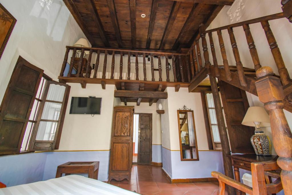 Postel nebo postele na pokoji v ubytování Meson del Alferez Xalapa