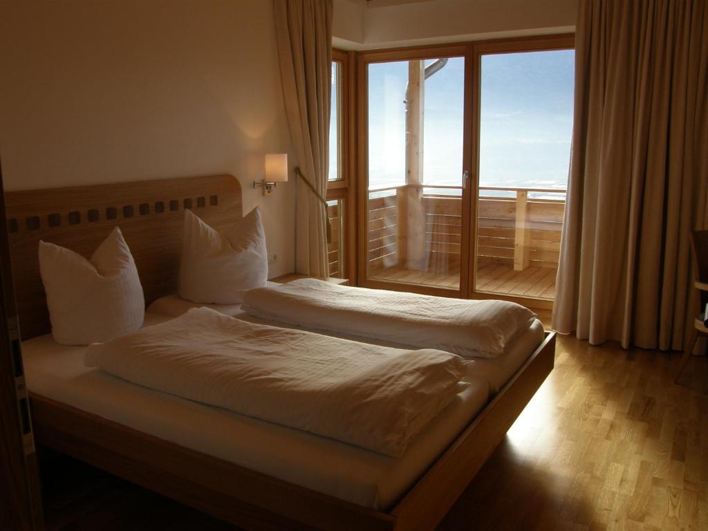 A bed or beds in a room at Apartments Karlhof