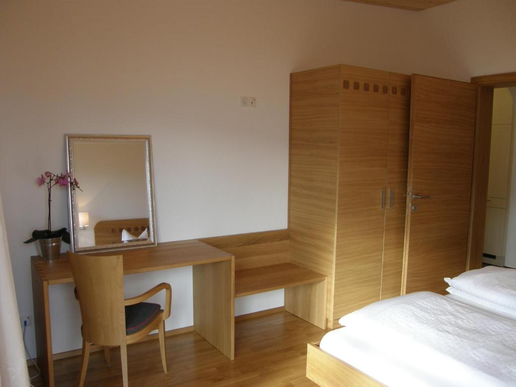 A bed or beds in a room at Apartments Karlhof