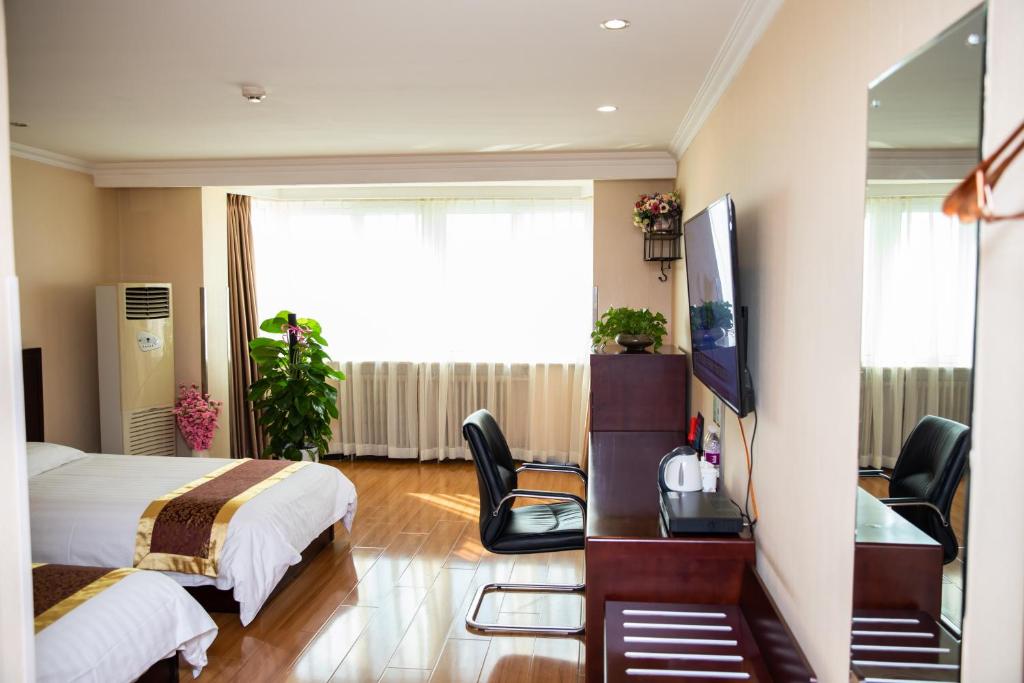 TV a/nebo společenská místnost v ubytování Meiyuan Hotel