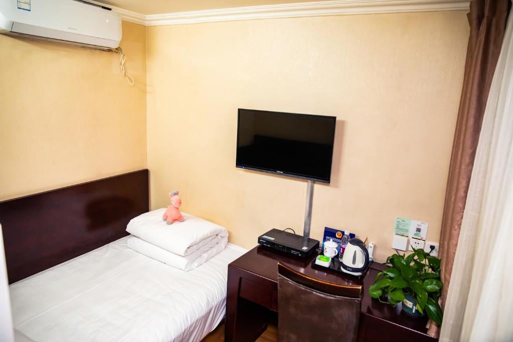 Postel nebo postele na pokoji v ubytování Meiyuan Hotel