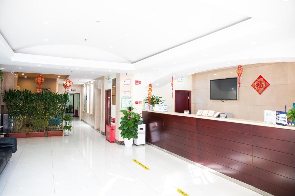 TV a/nebo společenská místnost v ubytování Meiyuan Hotel
