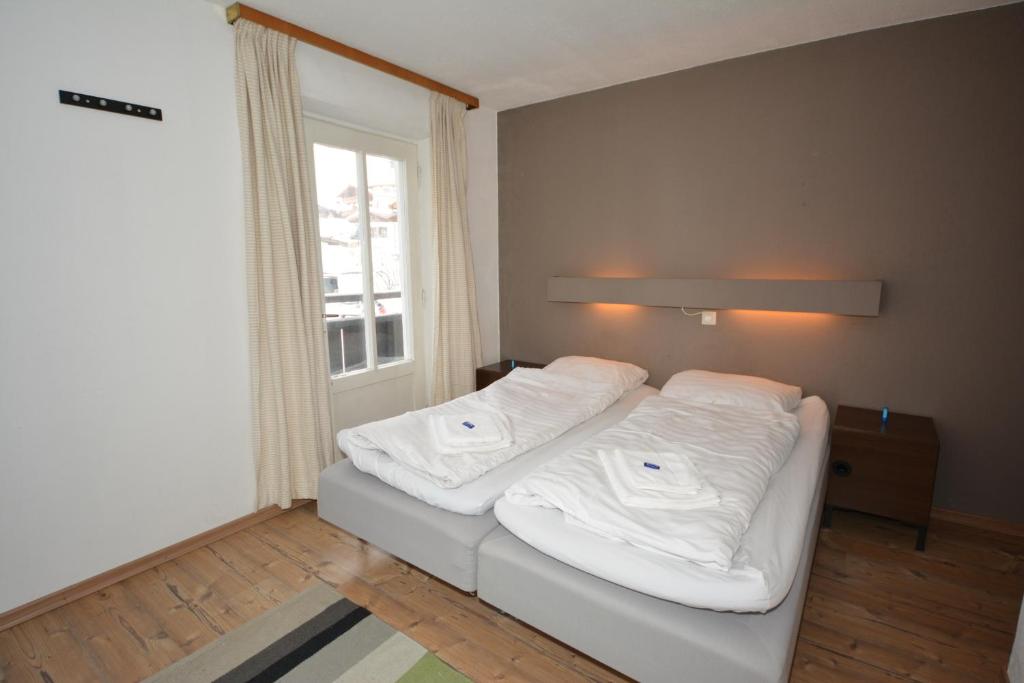 Letto o letti in una camera di Haus Irmgard by Châtel Reizen