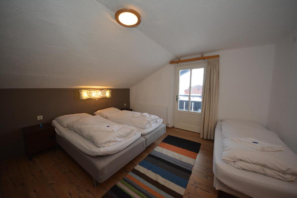 Letto o letti in una camera di Haus Irmgard by Châtel Reizen