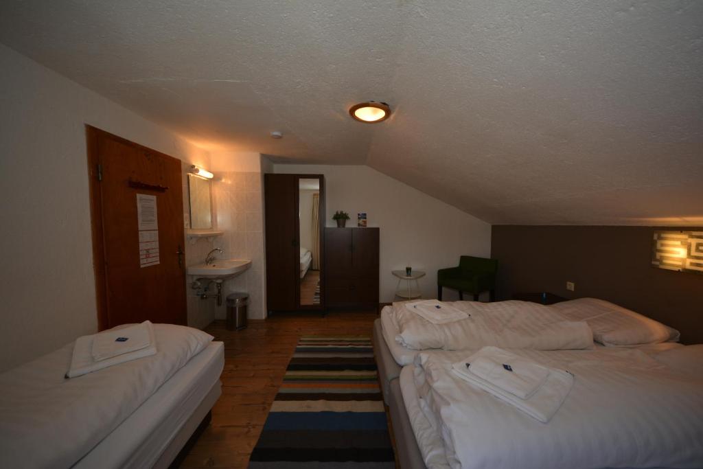 Letto o letti in una camera di Haus Irmgard by Châtel Reizen