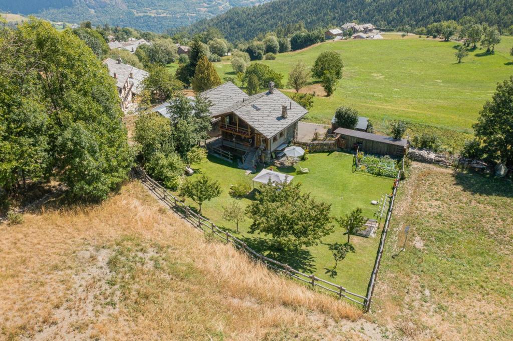 an aerial view of a house on a hill at CleMaison Antica Dimora Apartments CIR VDA GIGNOD 0013 in Gignod