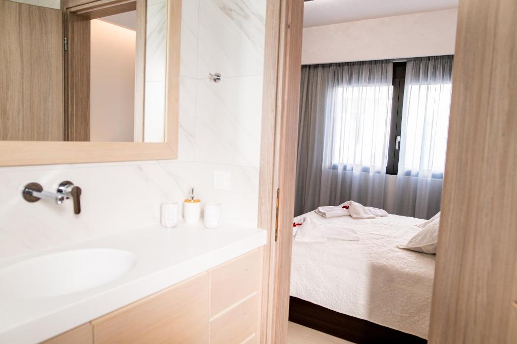 Łóżko lub łóżka w pokoju w obiekcie Lilium Apartment