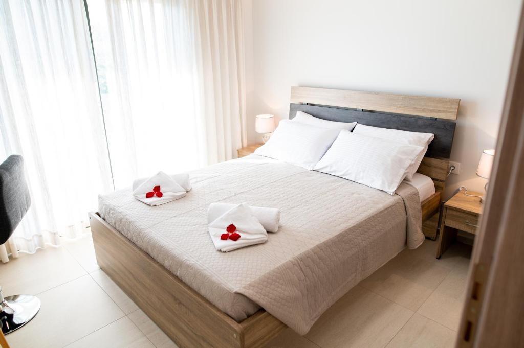 Łóżko lub łóżka w pokoju w obiekcie Lilium Apartment