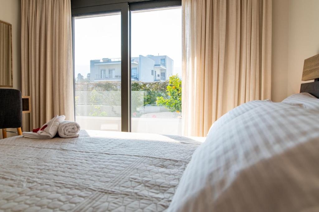 Łóżko lub łóżka w pokoju w obiekcie Lilium Apartment