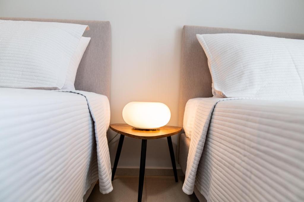 Łóżko lub łóżka w pokoju w obiekcie Lilium Apartment