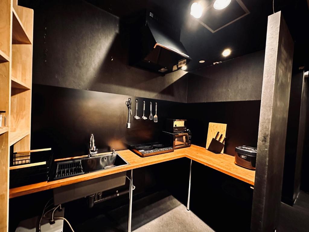 Kuchyň nebo kuchyňský kout v ubytování Namba Guesthouse HIVE