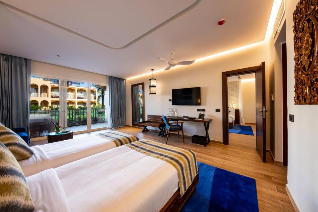 Postel nebo postele na pokoji v ubytování The Mora Zanzibar - Luxury All Inclusive