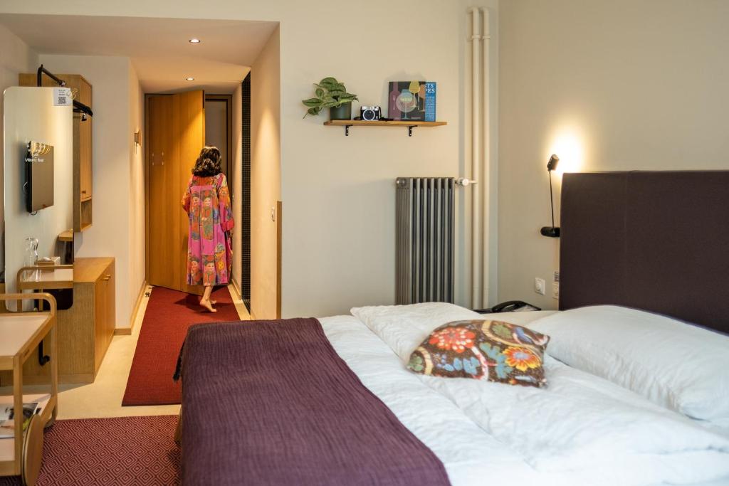 Postel nebo postele na pokoji v ubytování Nomad Design & Lifestyle Hotel