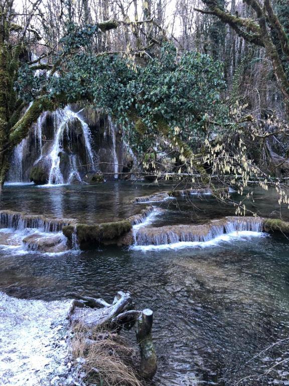 a waterfall in the middle of a river at Gite de la cascade in Les Planches-près-Arbois