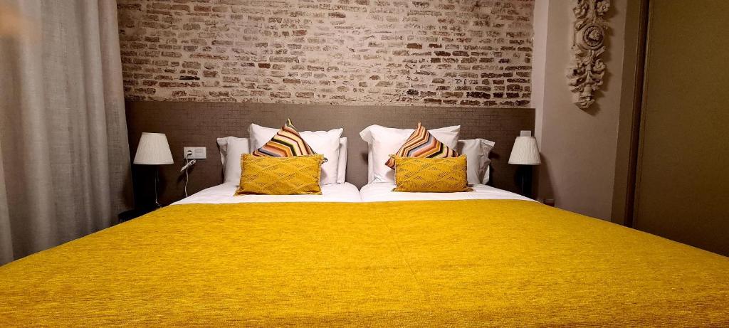 A bed or beds in a room at Apartamento Viña P. Málaga Centro