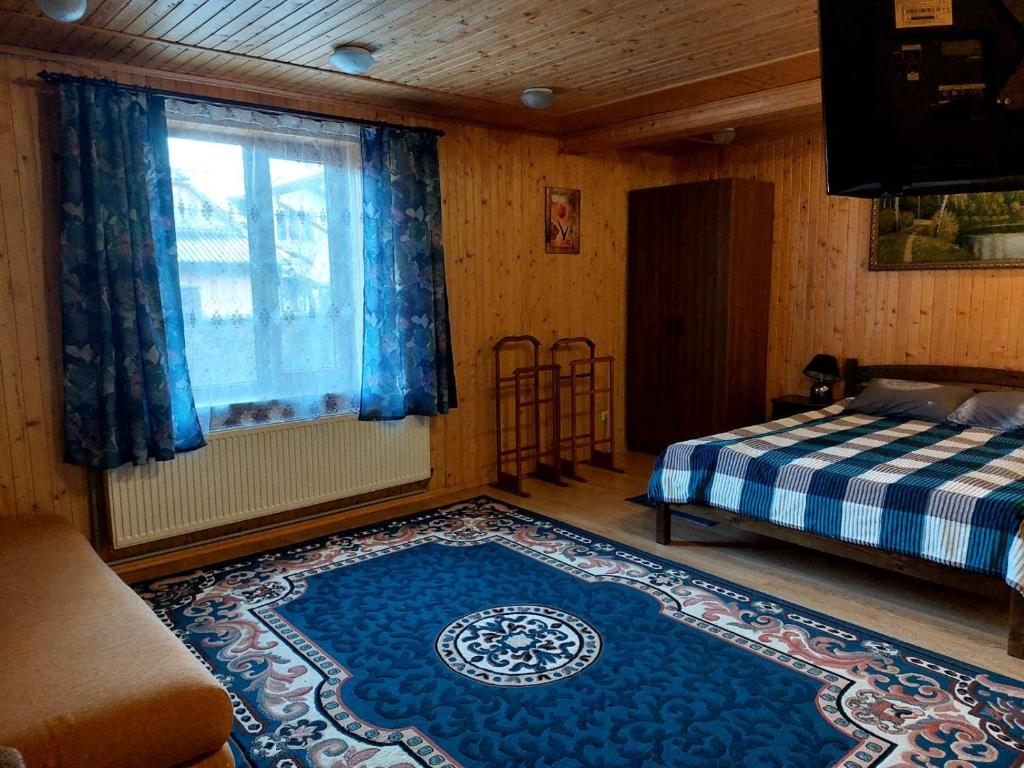 Posteľ alebo postele v izbe v ubytovaní Сімейний котедж У Діани