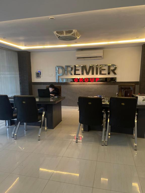 a person sitting at a desk in a office with a laptop at Premier Heights in Jhelum