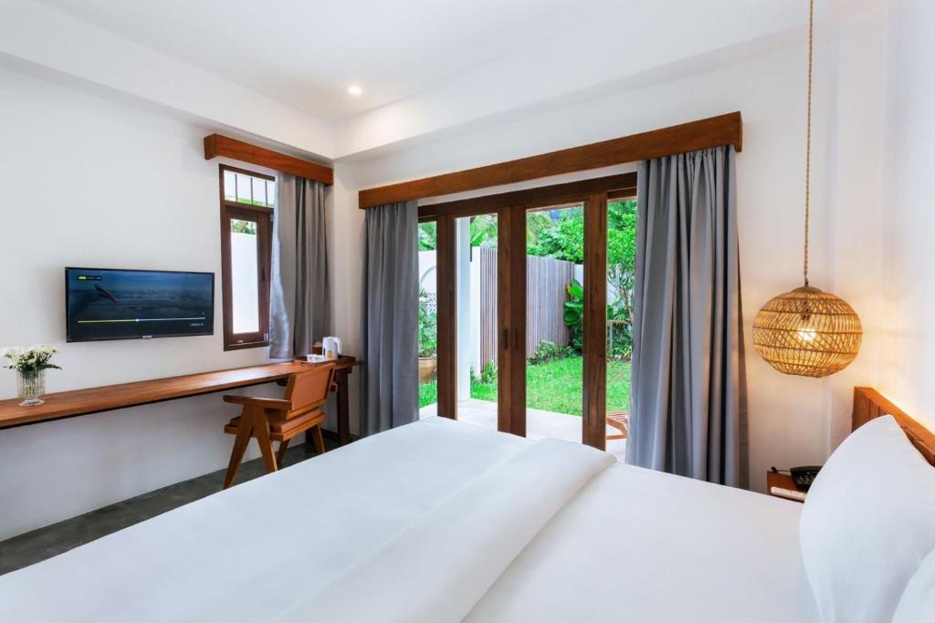 Postel nebo postele na pokoji v ubytování Phang Nga Origin Hotel