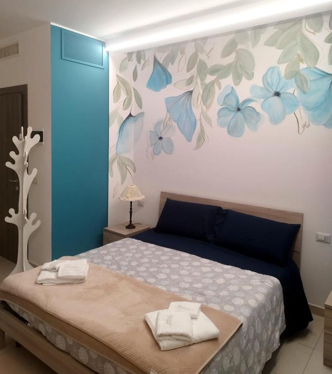 A bed or beds in a room at Massanè Casa Vacanza