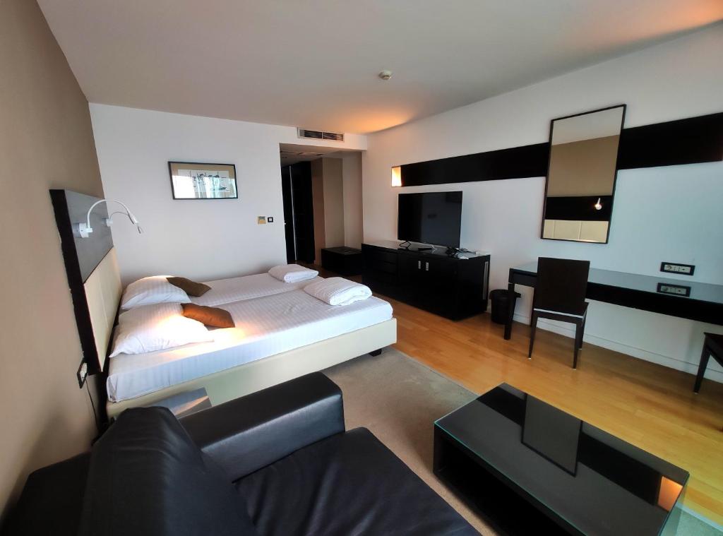 Posteľ alebo postele v izbe v ubytovaní Hotel San Antonio