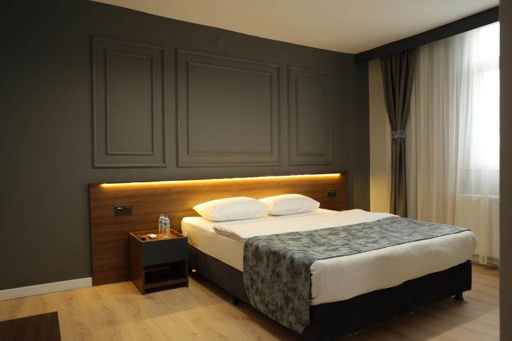 Postel nebo postele na pokoji v ubytování Turkuaz Hotel
