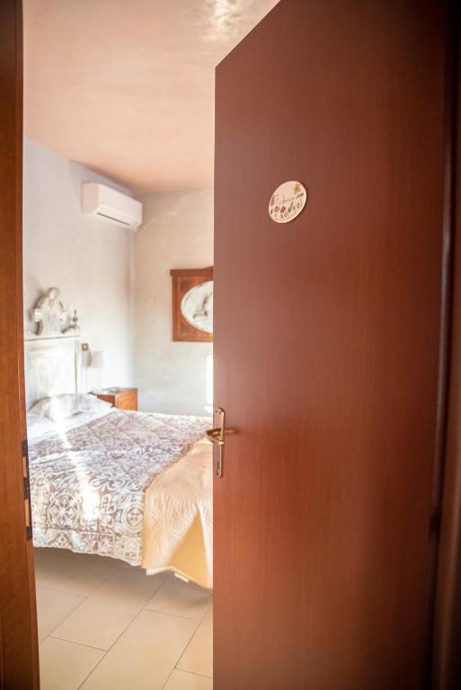 Posteľ alebo postele v izbe v ubytovaní B&B LELLA
