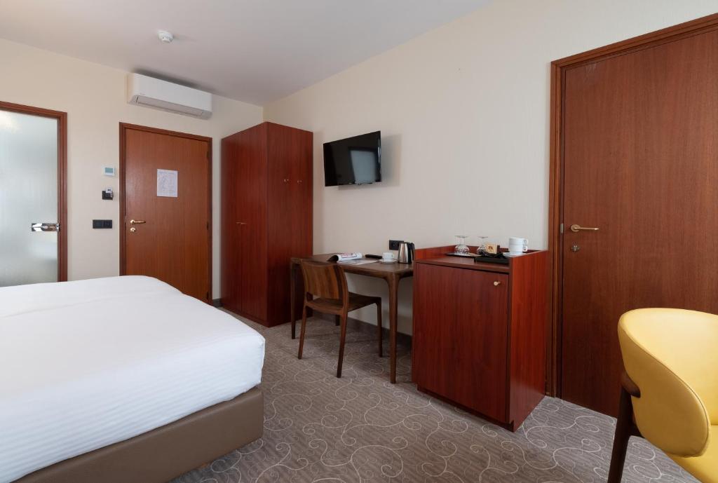 Postel nebo postele na pokoji v ubytování Rosenburg Hotel Brugge
