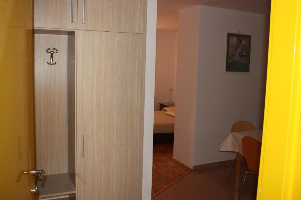 Łóżko lub łóżka w pokoju w obiekcie Apartments Tomato