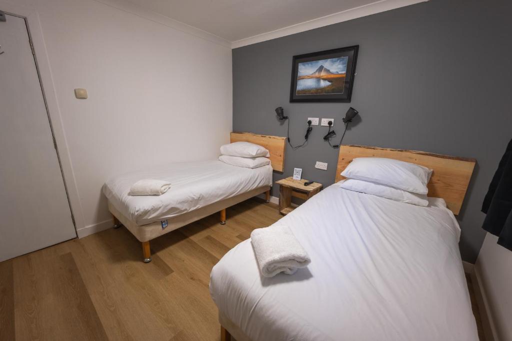 Postel nebo postele na pokoji v ubytování Roam West