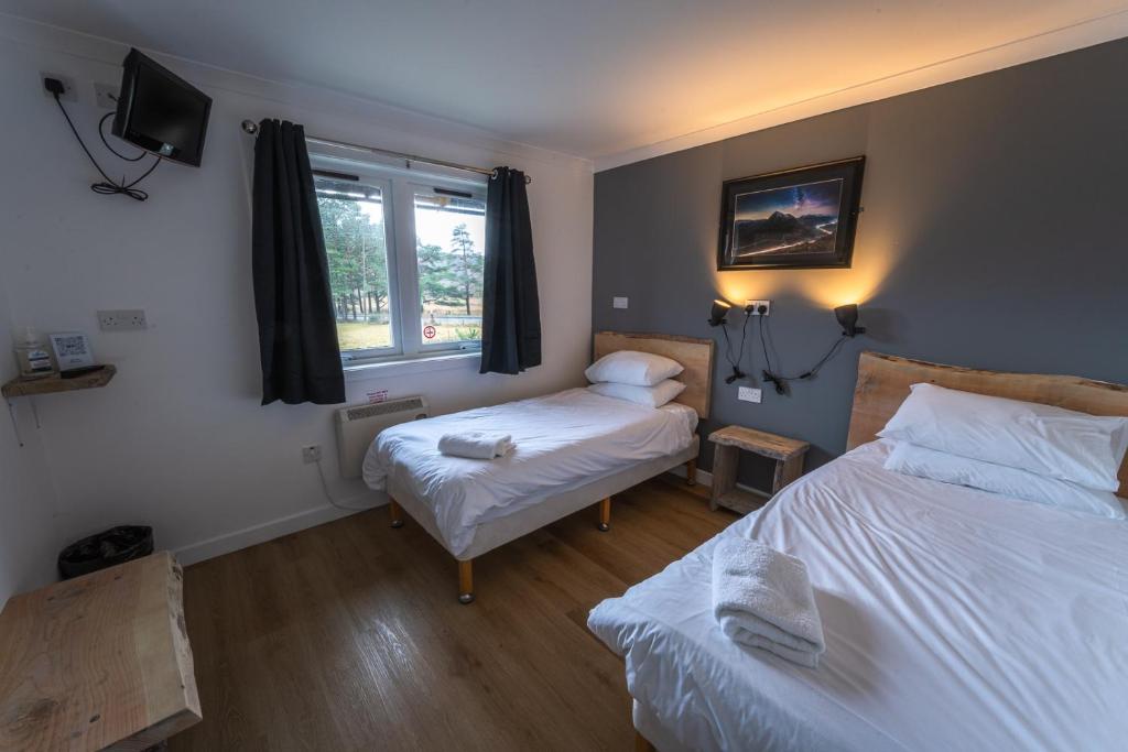 Postel nebo postele na pokoji v ubytování Roam West