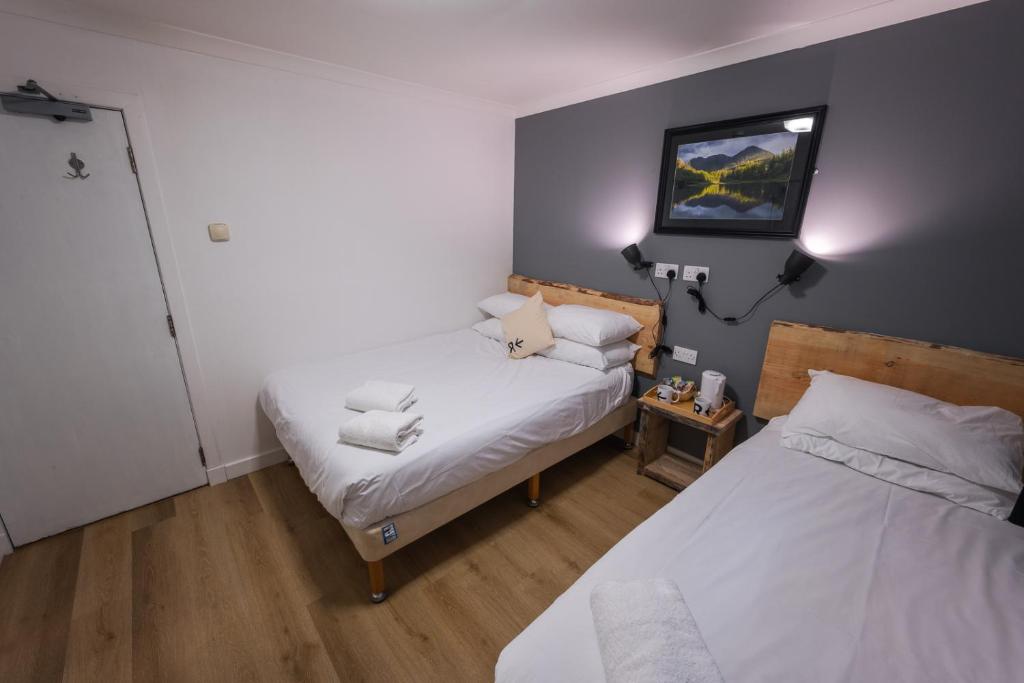 Postel nebo postele na pokoji v ubytování Roam West