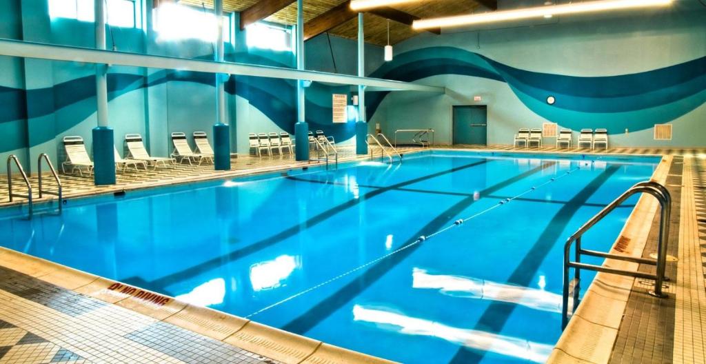 a large swimming pool with blue water at The Lodge at Wisp in McHenry