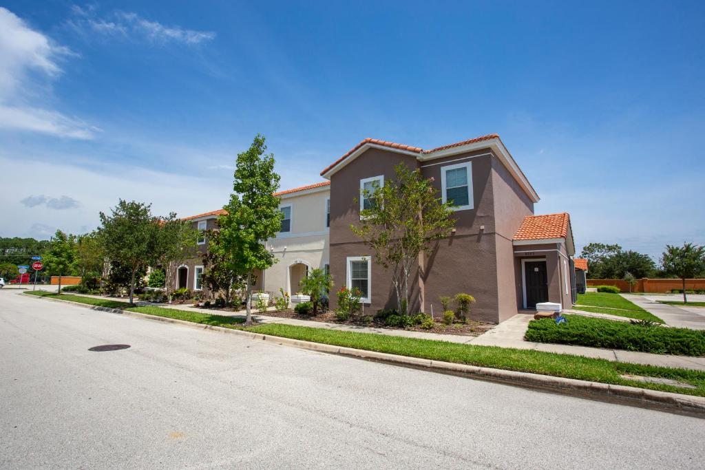 a house on the side of a street at Four Bedrooms Townhouse 4563 in Kissimmee