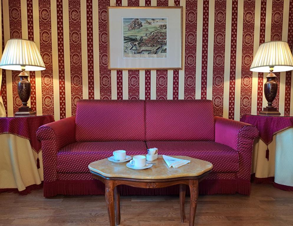 a living room with a couch and a coffee table at Sina Palazzo Sant'Angelo in Venice