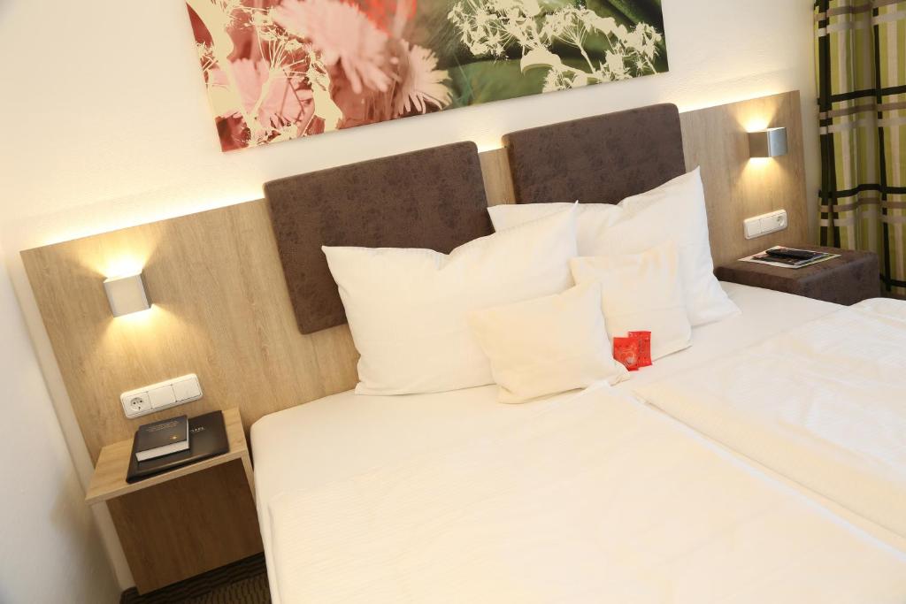 Postel nebo postele na pokoji v ubytování Central Hotel Eschborn