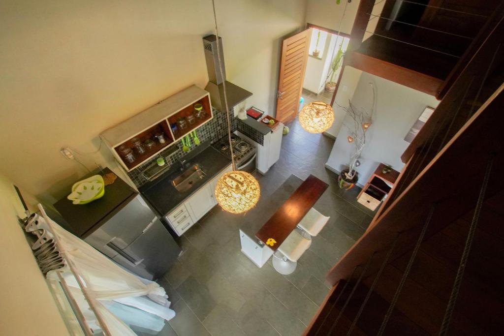 an overhead view of a kitchen with a stove at Flor da Mata in Pipa
