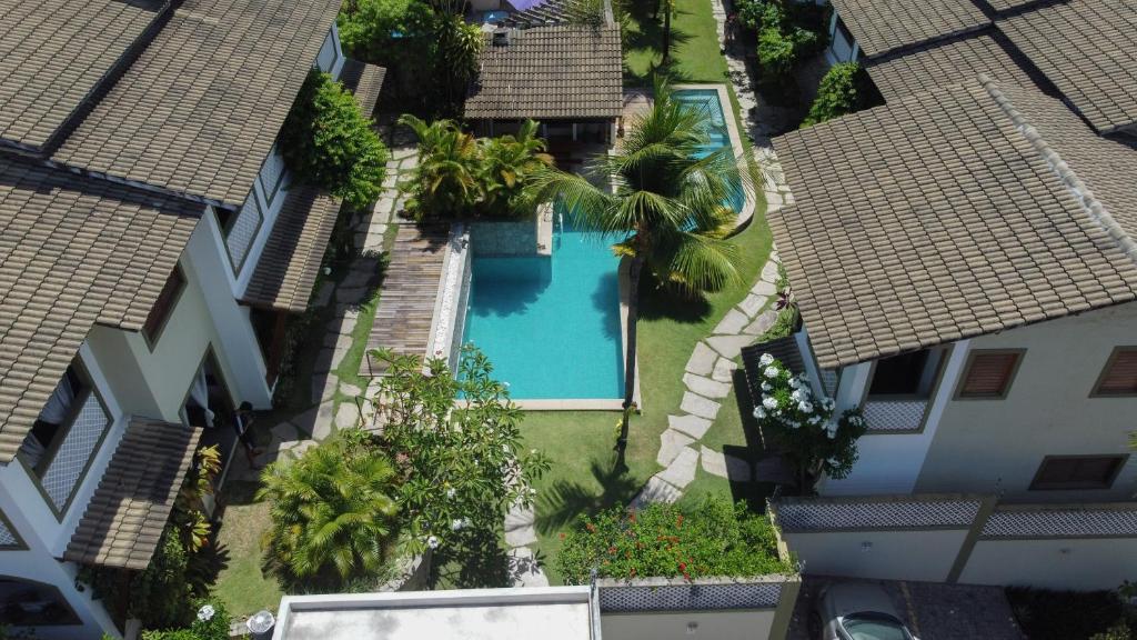 an overhead view of a swimming pool between two buildings at Flor da Mata in Pipa